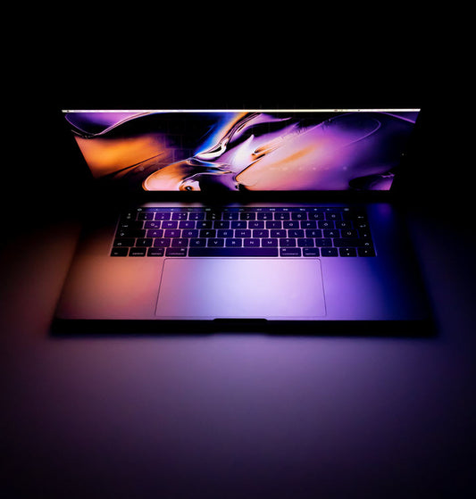 Buy Nic Salts Online. Partially open laptop. Photo by Daniel Korpai on Unsplash