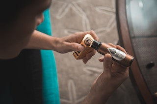 Person Putting E-Juice on Vape, Photo by VapeClubMY on Unsplash