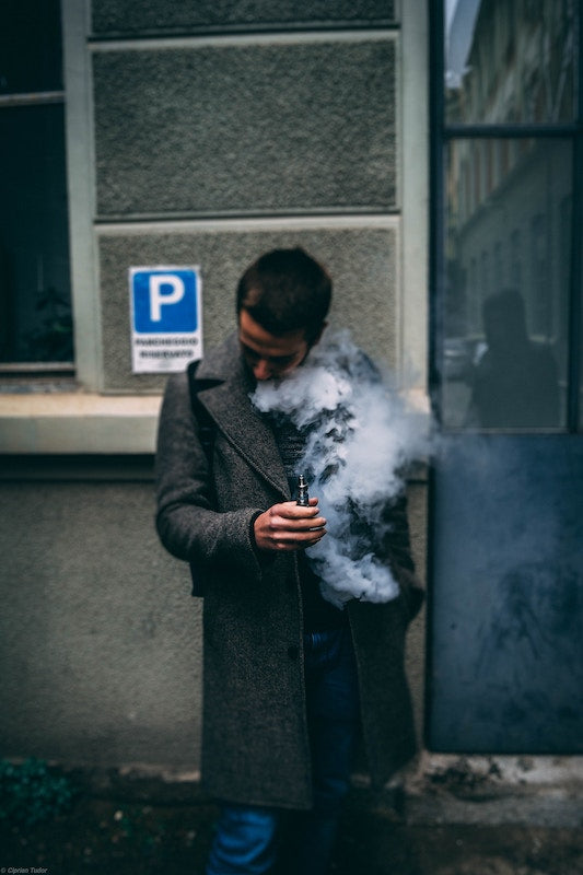 Man Vaping Outside, Photo by Ciprian Tudor on Unsplash