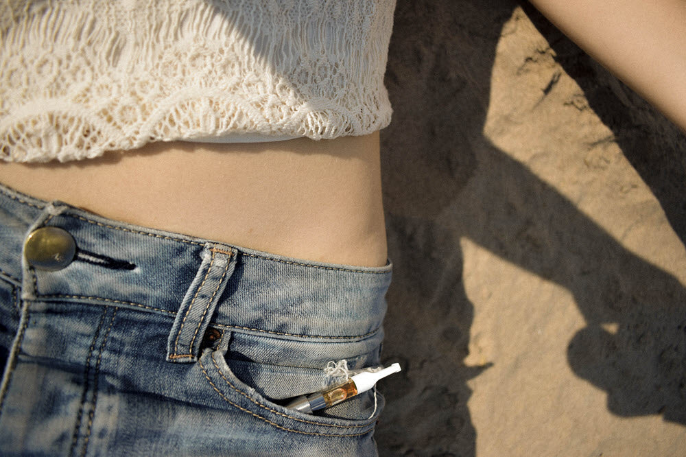 Vape pen in jeans pocket. Photo by Maria Badasian on Unsplash